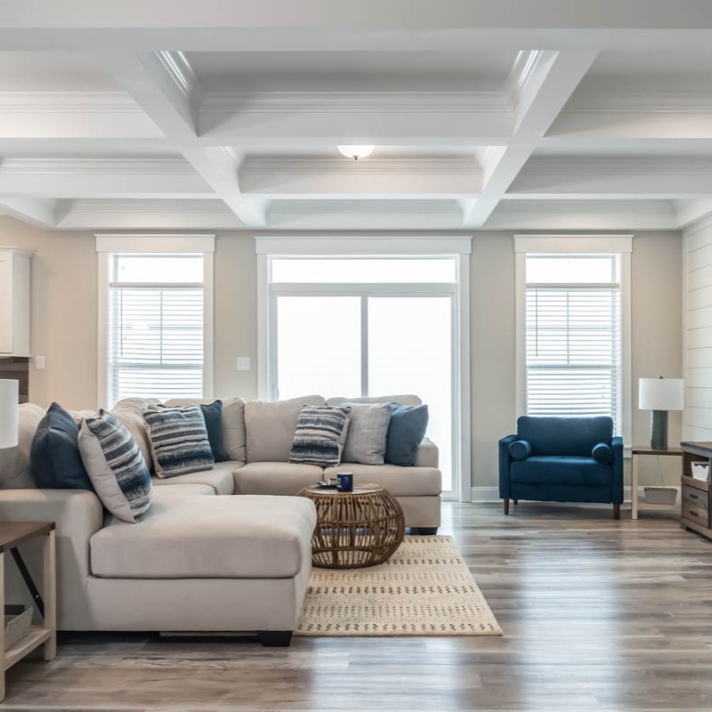 photo of an open living room with coffered ceiling