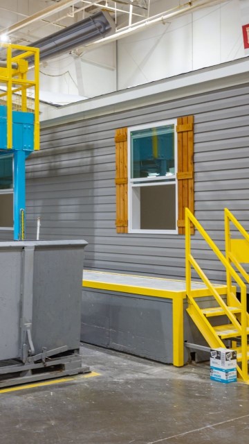 inside a climate controlled manufactured home building facility