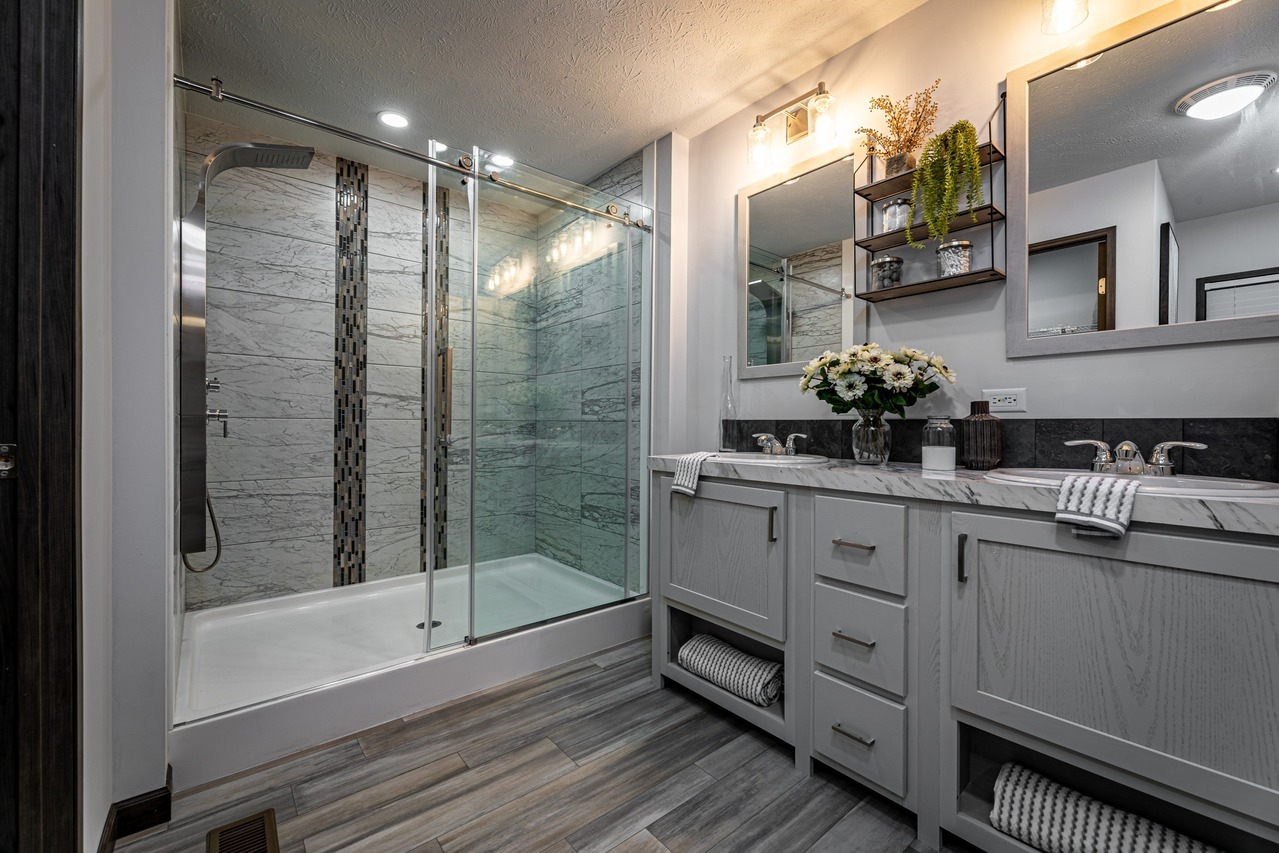 Interior bathroom shower and sink of a modular home, the Aberdeen, built by Cavco - Nappanee