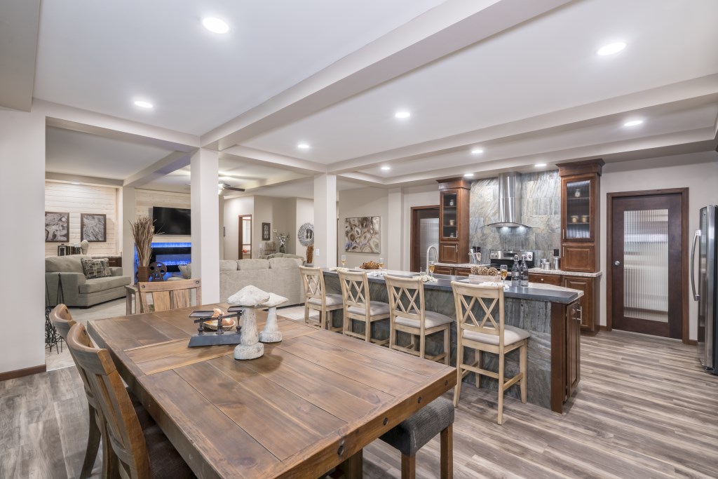 Open kitchen and dining room in Cavco – Goshen modular factory-built custom home