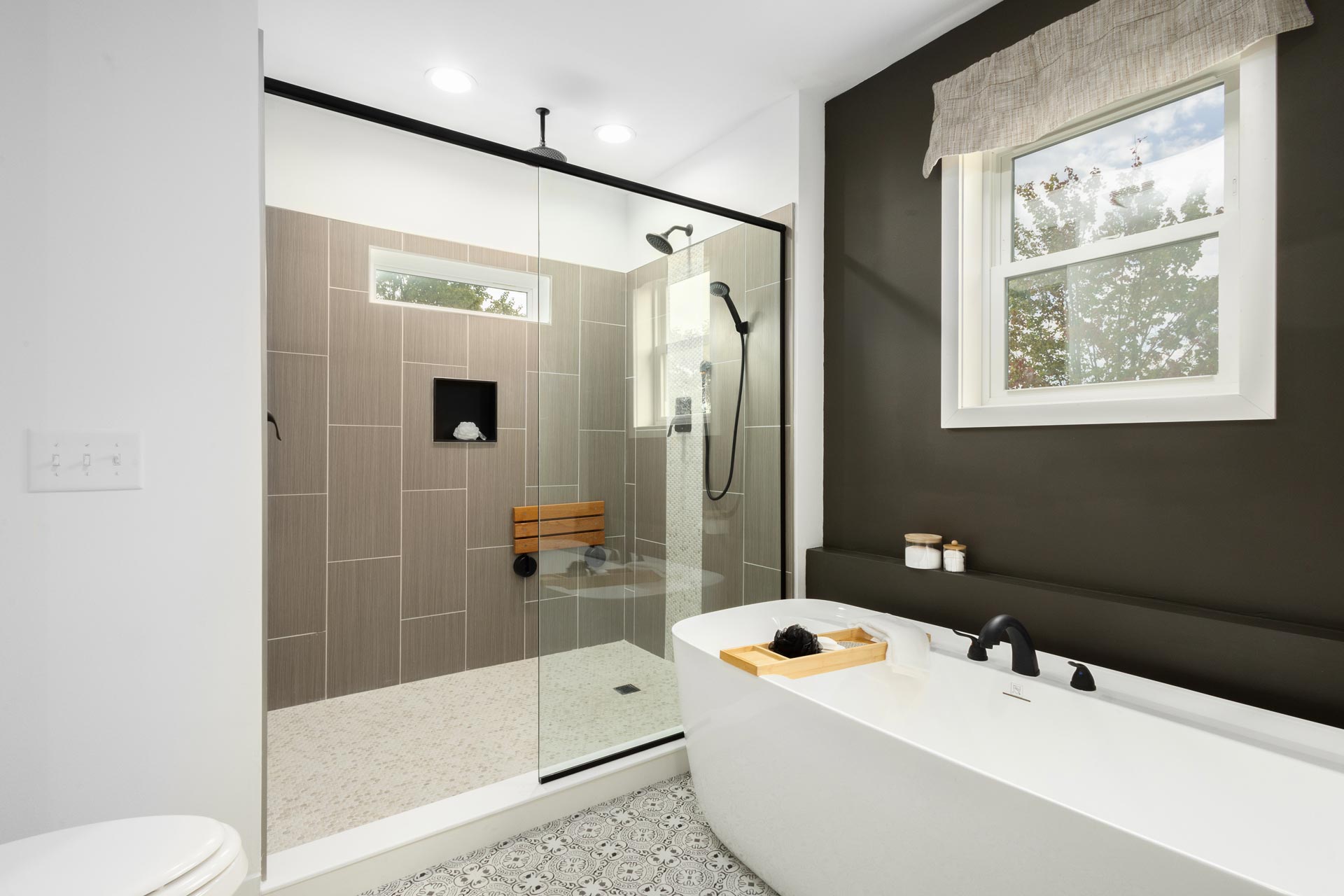 Cavco-Manorwood Classic modular home bathroom with modern tile and white tub and separate shower