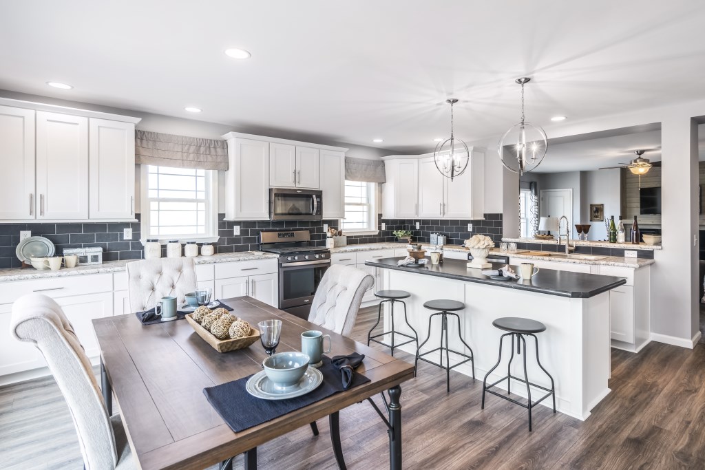 Cavco Manorwood custom modular home kitchen with upgraded cabinetry and finishes, open design